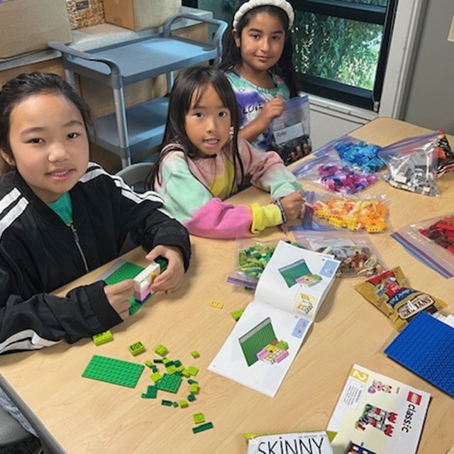 Students building a Lego house with Dr. Carter at the Lego Party! 
